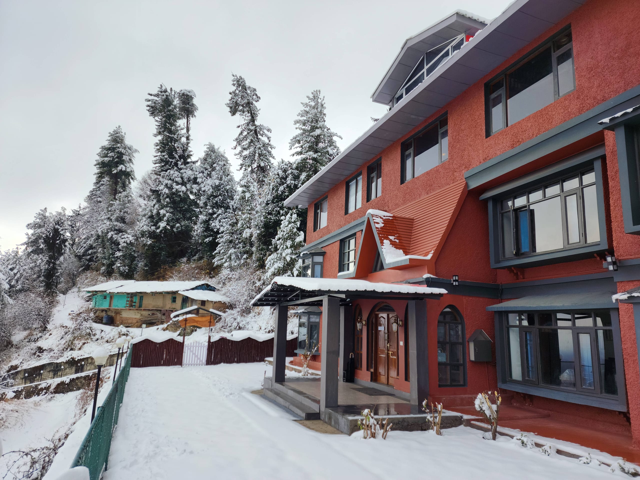 The Himalayan Shire homestay covered in winter snow at Fagu, near Shimla